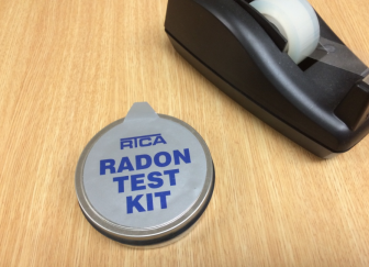 Sorry, the tape dispenser doesn't come with the radon test kit. We're showing it in this picture to illustrate the size of the test kit (about 3 inches in diameter, if that). Take the test kit, leave the tape.