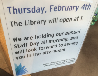 The bottom of this announcement near the entrance to the library says "Access