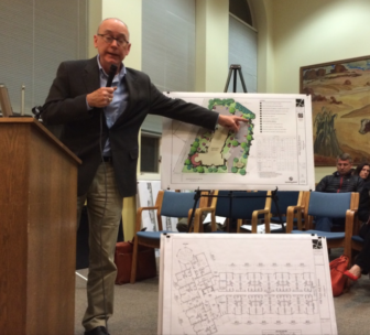 The project's landscape architect, Phil Barlow, points as he makes a point to the commission. 