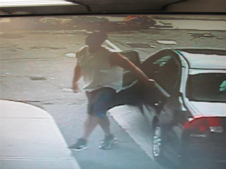 The suspect leaving a car at the gas station (from video surveillance records)