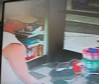 The suspect at the Exxon gas station (from the store's video surveillance camera)