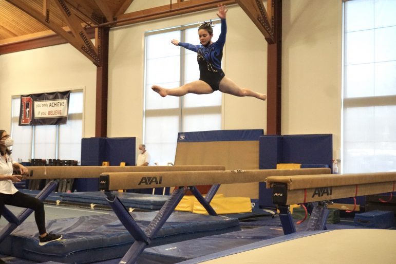 Co-Captain Megan Cutler's beam routine balances DHS Gymnastics Team Jan 2022