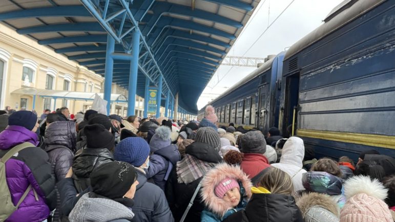 Ukrainian refugees getting on train