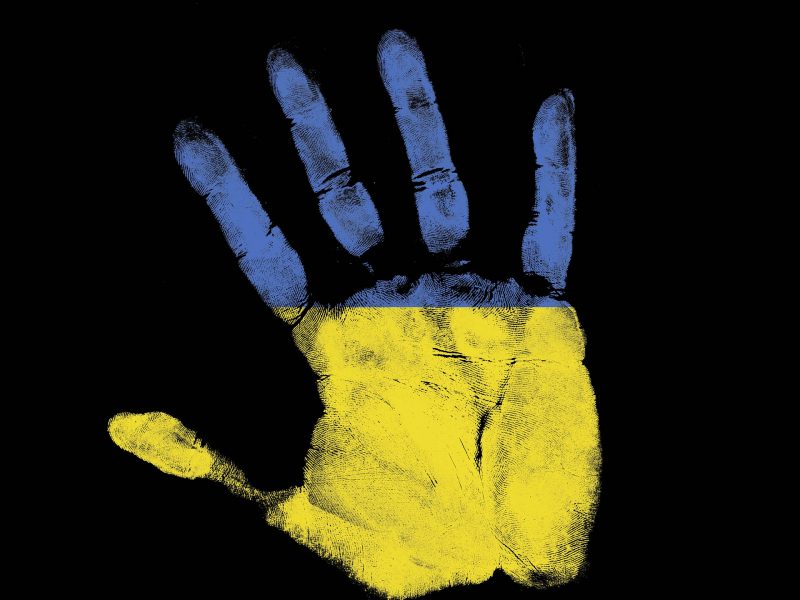 Hand Ukrainian flag fundraiser